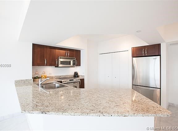 4th image of 19900 E Country Club Dr APT 1009