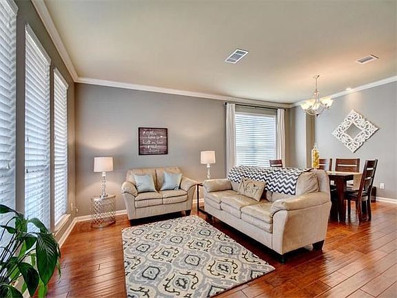 Lots of great features such as hardwoods, art niches, upgraded tile, and freshly painted bright and 