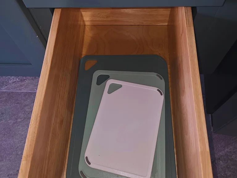 Convenient cutting boards included for everyday cooking.
