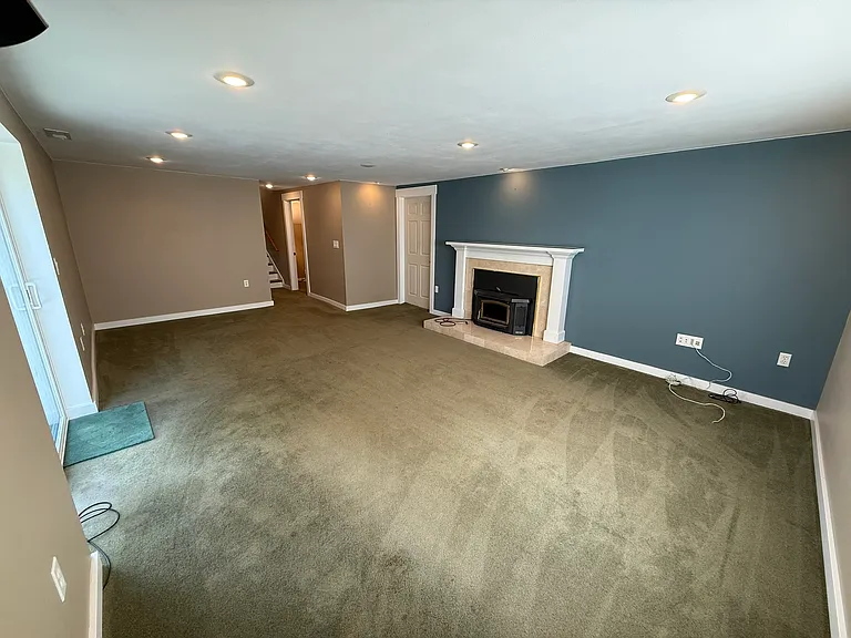 Downstairs family room. Set up for home theater.