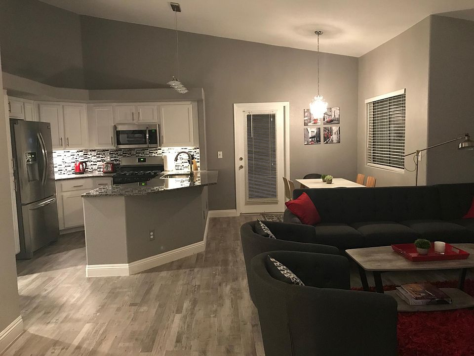 open living/dining/kitchen with vaulted ceilings