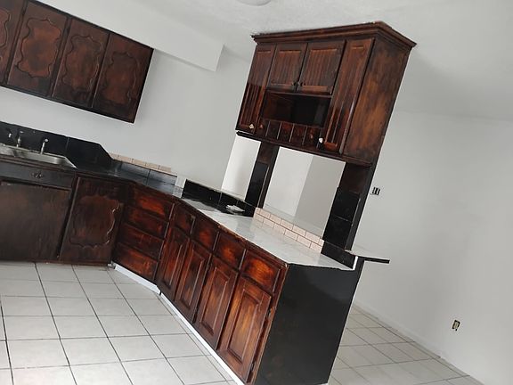 Separate kitchen with plenty of cabinet and counter space