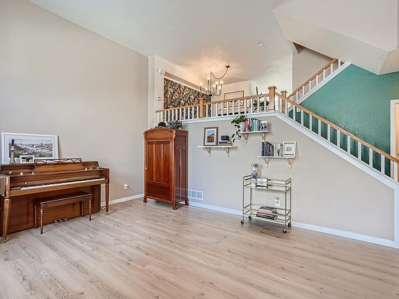 Upon walking into the front door, large living room (can host sectional, dual couches and more) w/ half bathroom located off to the right