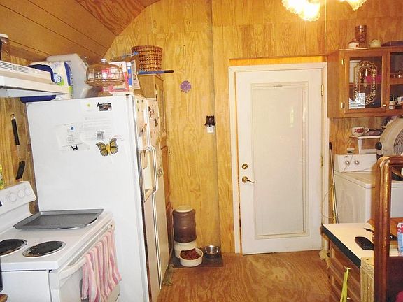 Kitchen with door to bathroom