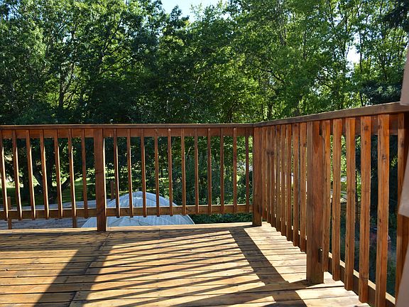deck; view to south of tree canopy of adjacent city park