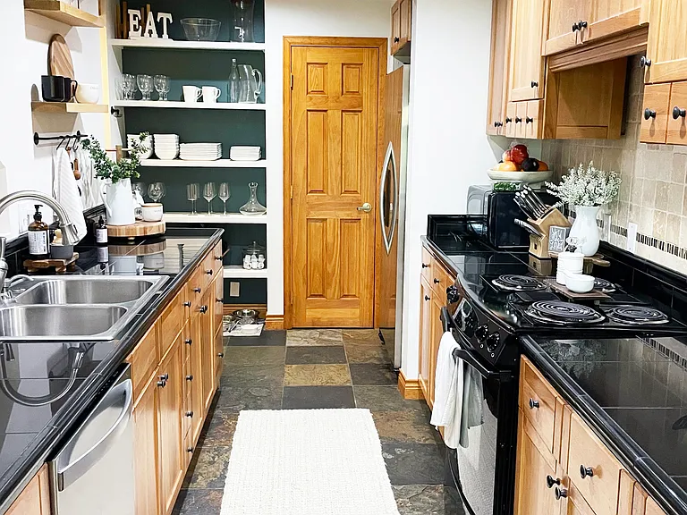 Lovely kitchen with a functional galley layout, open to dining area and living space