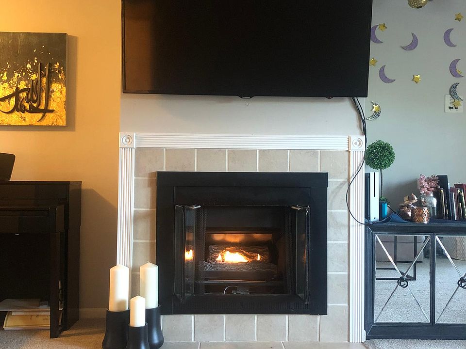 Cozy electric fireplace at the center of the living room.