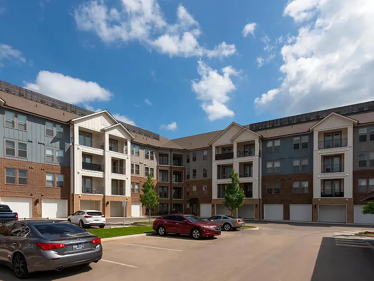 Parking Lot View of The Harper Apartments with Attached Garages
