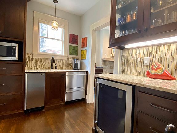 Butler's pantry with Monogram Icemaker, wine Cooler, microwave, and 2nd dishwasher.