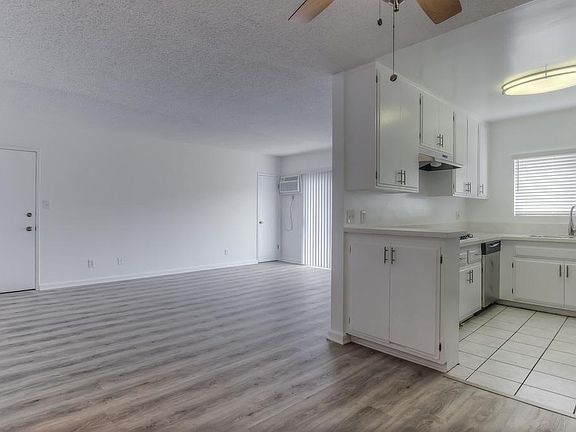Natural lighting, wood floors and plenty of cabinet space.