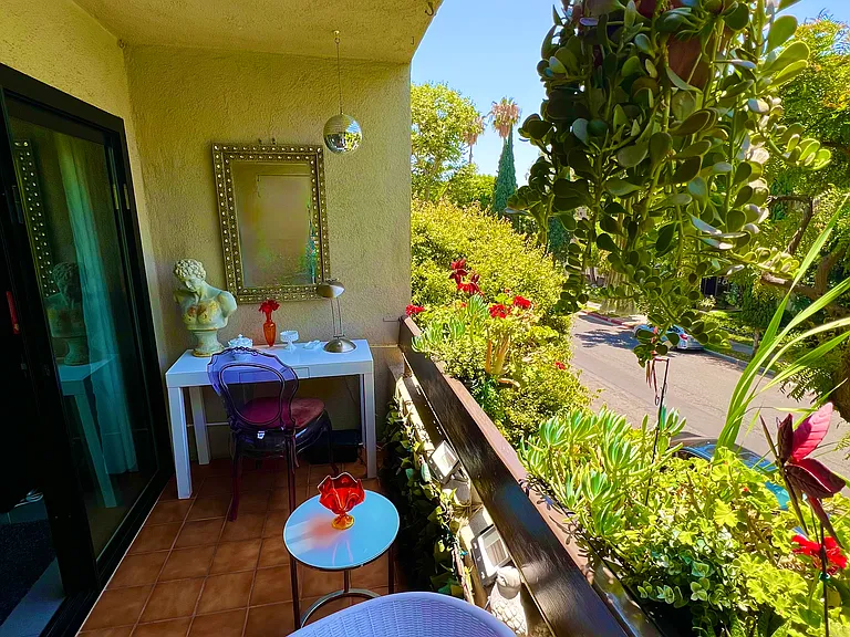 Desirable front facing bright western Balcony overlooking one of West Hollywood best tree lined streets.