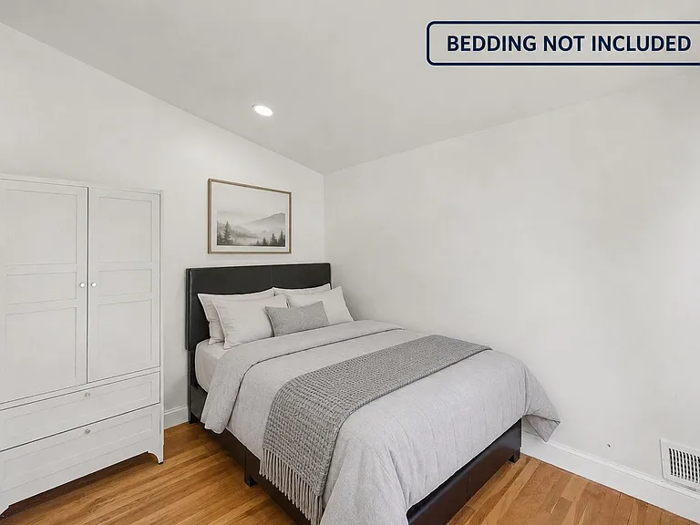 Compact bedroom with hardwood floors, recessed lighting, and a closet/wardrobe for convenient in-room storage.