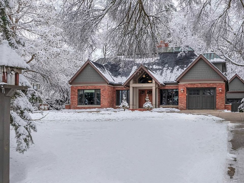 The tree lined home site and circular driveway welcome residents and guests to this stately, beautif