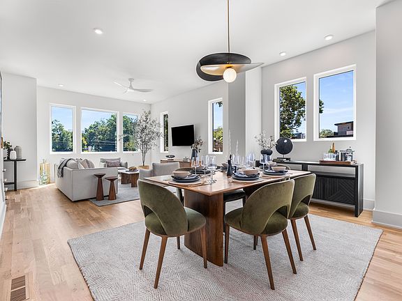 Dining and living room in the staged model.