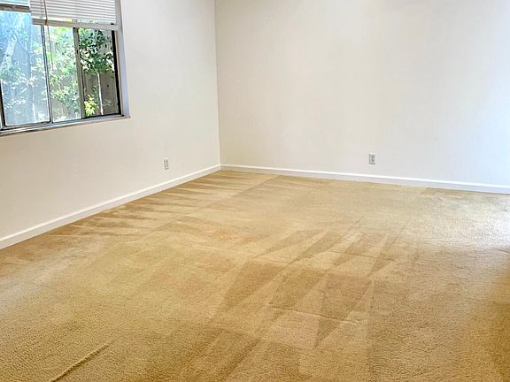 Living area with ceiling fan with lights