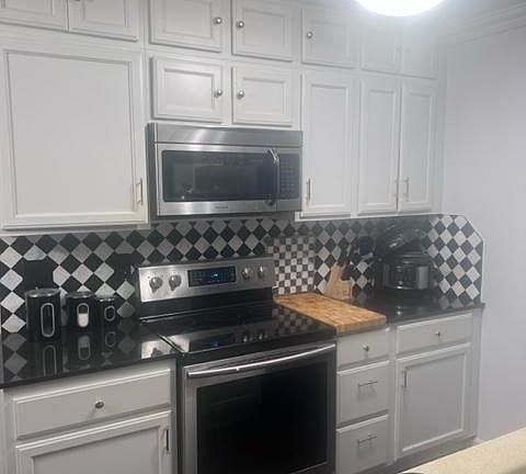 Kitchen-Built in Mircowave, Stainless steel and black stove