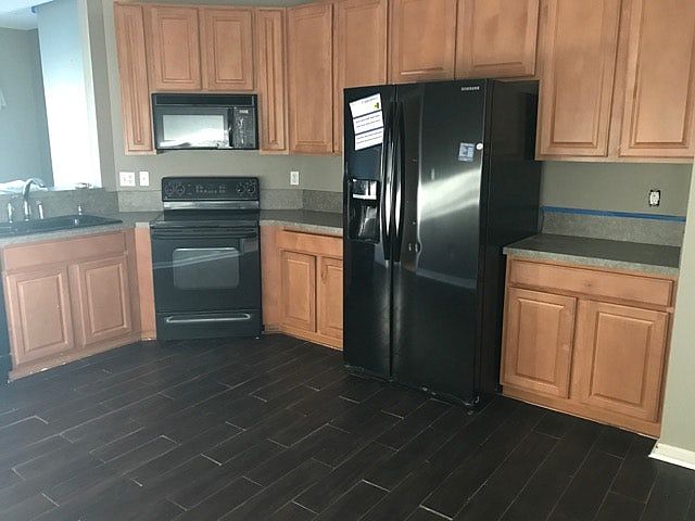 Kitchen - includes dishwasher, stove, microwave and refriger