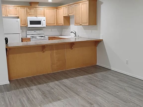 Spacious kitchen with breakfast bar.