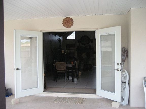 French doors leading out to pool