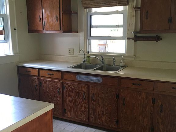 Kitchen - now has dishwasher, gray bottom cabinets and snazzy new counter tops