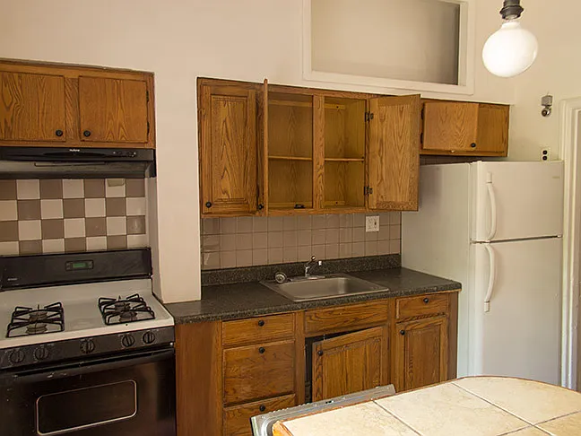 Kitchen area has dishwasher with counter top. New Refrig and stove.