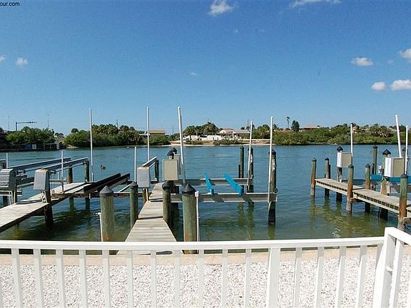 This condo has a dock w/lift in front of the condo