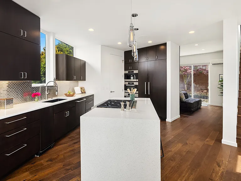 Kitchen is central to movie room and dining room