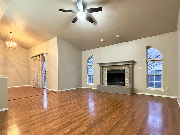 Living room overlooking the dining area and fireplace.