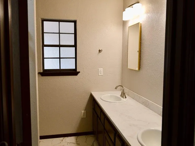 Double sinks and 2 medicine cabinets for extra storage.