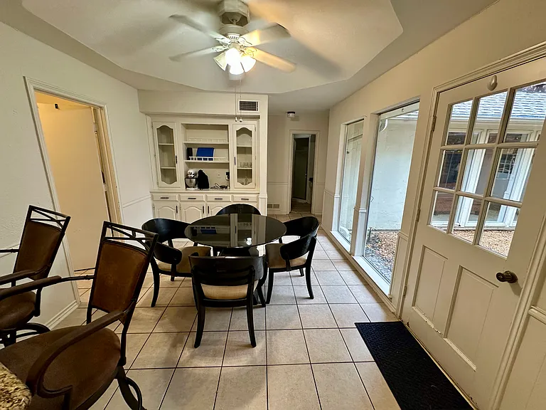 Breakfast room featuring a ceiling fan, and light tile patterned floors
