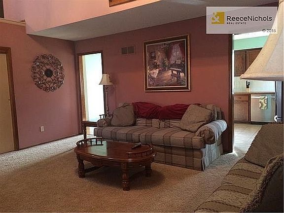 Large front living room features large coat closet