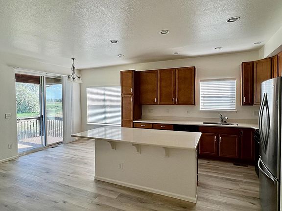 Living Room, Kitchen and sliding door to patio