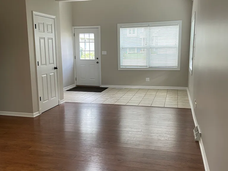 Front entry with guest closet and living room