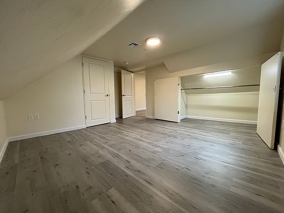 Photo of the bedroom from another angle showing the large bedroom closet