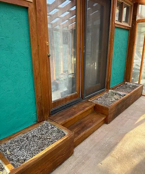Passive Solar heat helps keep the unit cosy in addition to the regular heat, and the beds are ready for planting.