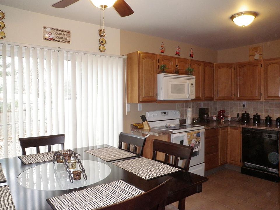 Dining Room with sliding doors to fenced back yard.