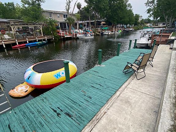 Over 50 feet of seawall and dock space. Park your boat in our brackish waters. And watch all the manatees swim around our deep canal.