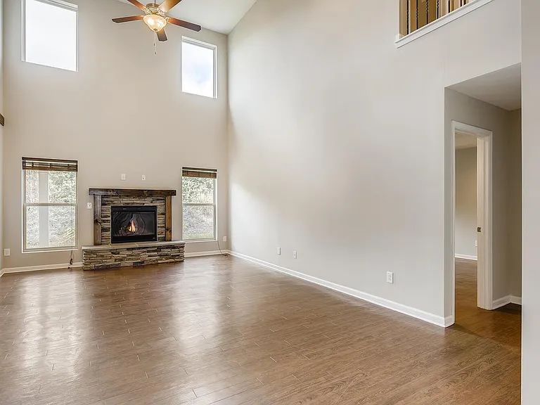 Two Story Great Room. Lots of natural light. Beautiful fireplace.