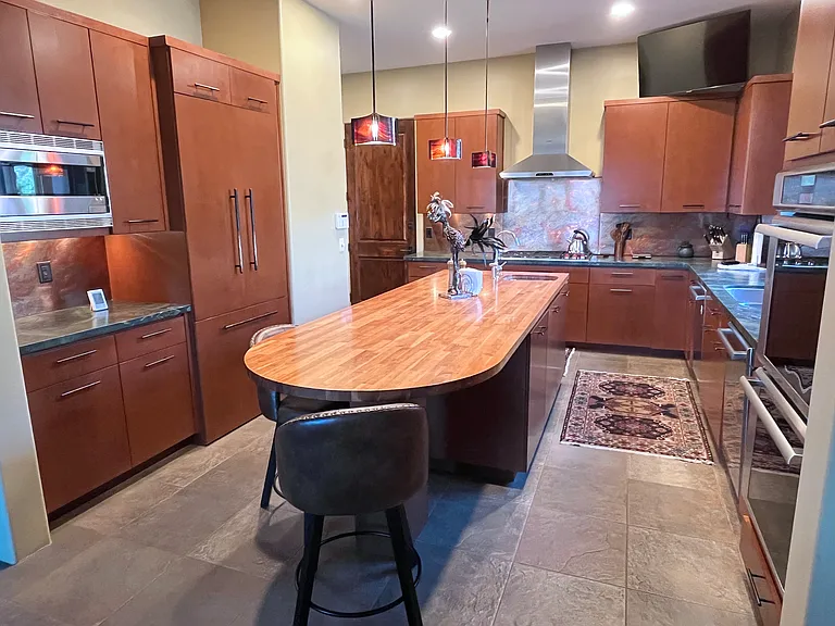 Upper Kitchen with Garage Door and Upper Laundry Room Beyond