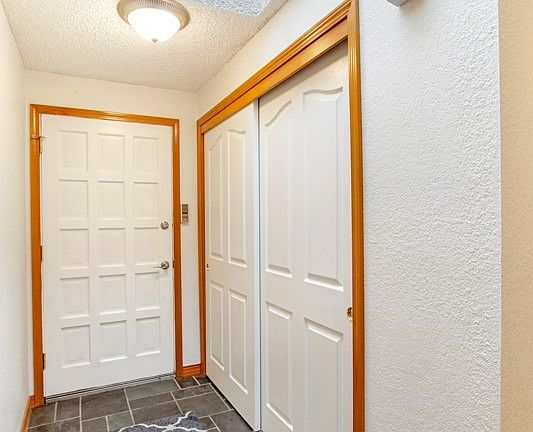 Entry way with big closet for coats.