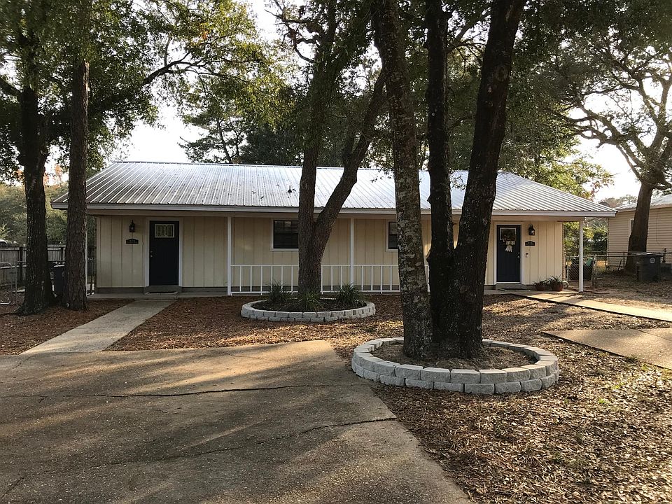 front of unit with fenced in yard.