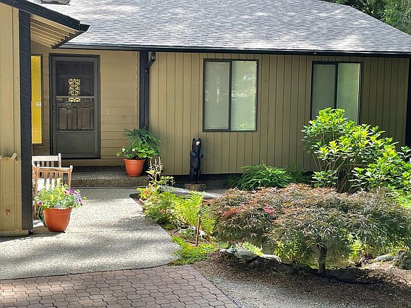 Front of home with pond