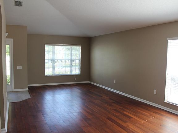 Living room and dining room. View from kitchen.