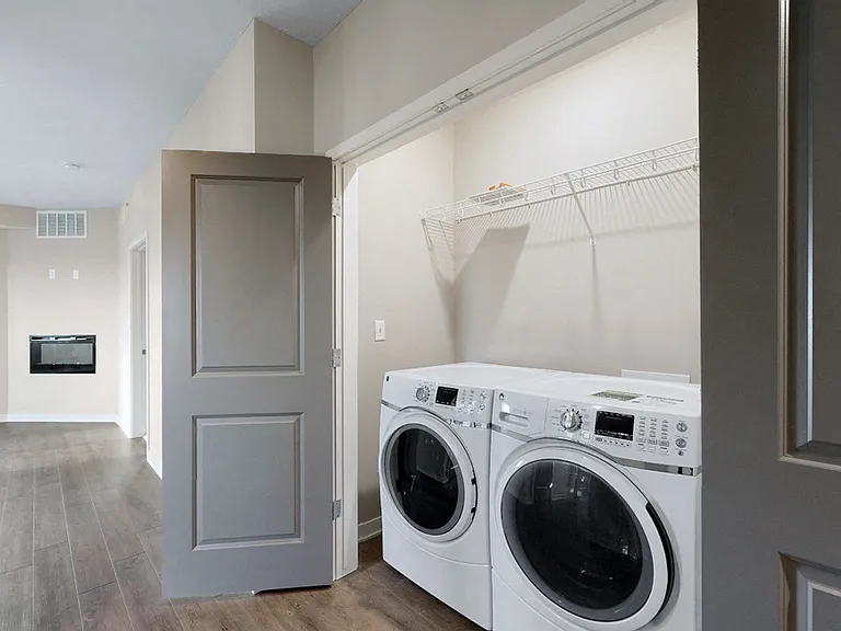 A washer and dryer are included in the 2 bedroom Marigold with den floor plan at WH Flats
