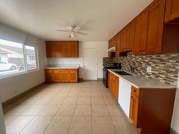 big kitchen with lot of cabinets
