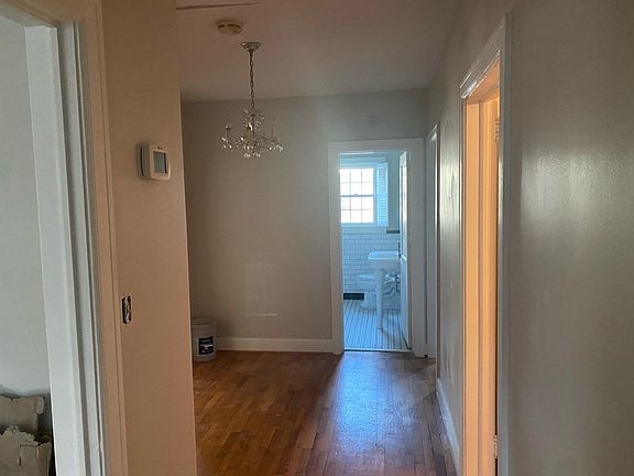 Large hallway with entry to living room, coat closet, bedroom #1, bathroom #1, and bedroom #2 and #3