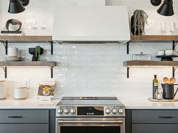 Kitchen with full-height tile backsplash