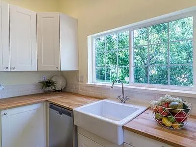 Light and sunny kitchen overlooking fruit trees in the back yard.