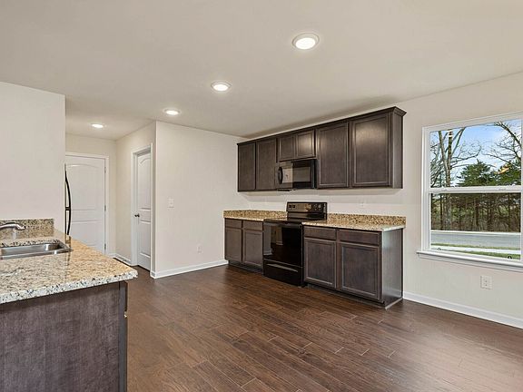 The kitchen is open to the dining room and living area.