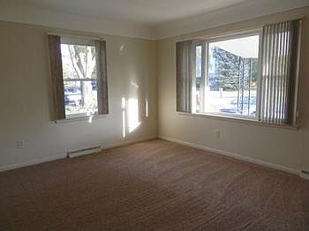 Living room with newer carpet & freshly painted